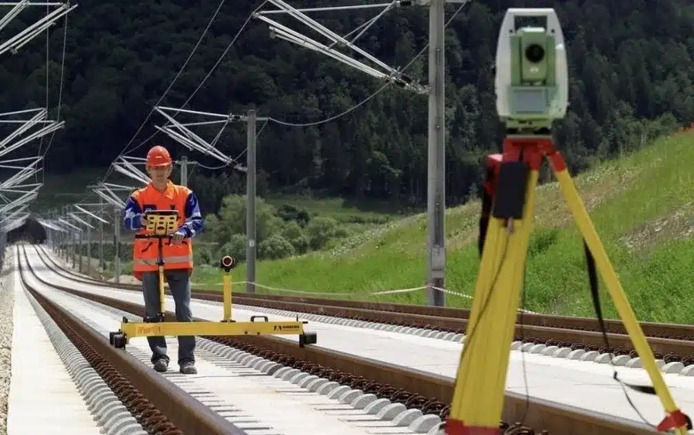 Amberg Clearance GRP 5000 Rail Clearance Survey Amberg Technologies SlabTrack GRP1000 system used on slab track construction site for high-precision surveying