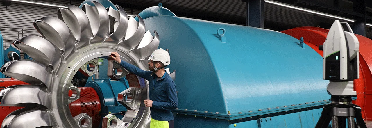 Leica Absolute Tracker AT500 measuring and aligning large turbine components in an industrial production environment