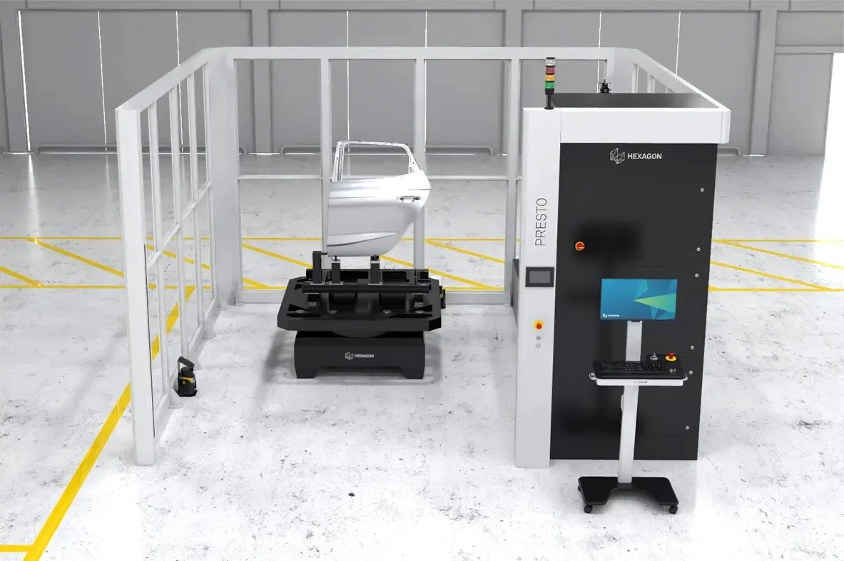 Hexagon PRESTO M Automated Inspection Cell Hexagon PRESTO M automated inspection cell with an automotive door panel mounted on the rotary table