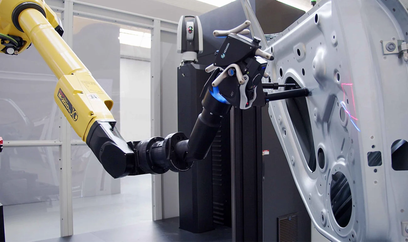 Robot-mounted Hexagon Absolute Scanner AS1 measuring an automotive body panel