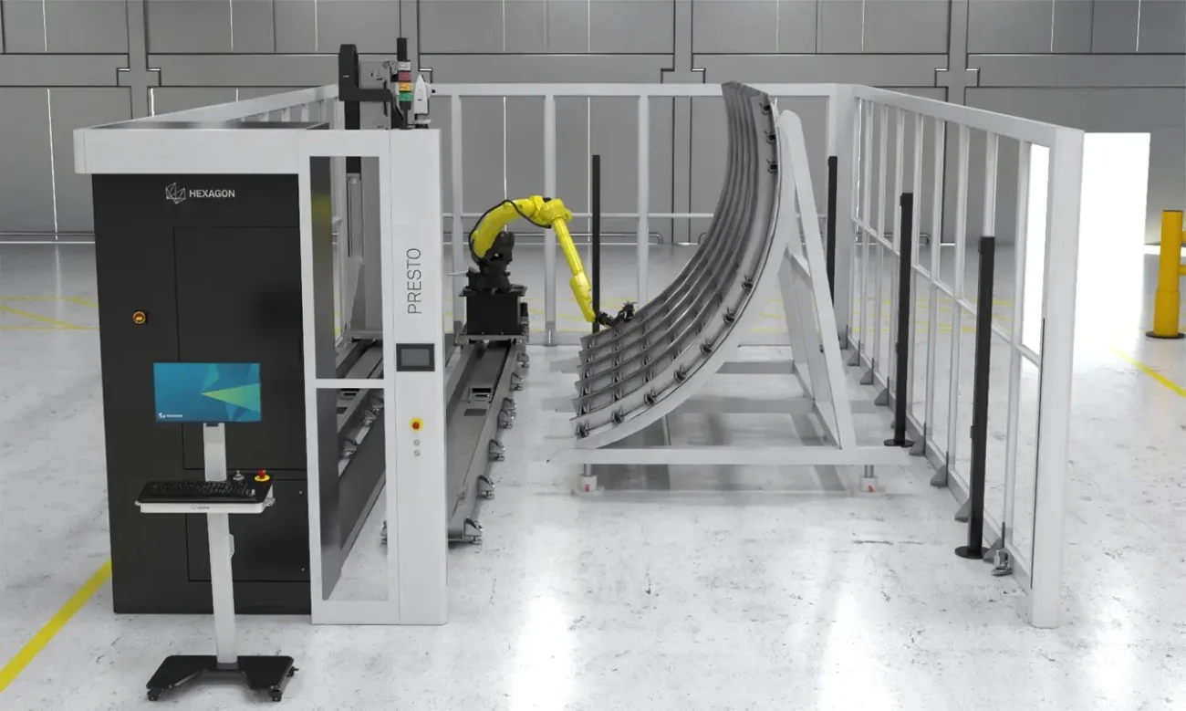 Hexagon PRESTO L Automated Inspection Cell Hexagon PRESTO L automated inspection cell measuring a large curved aerospace panel