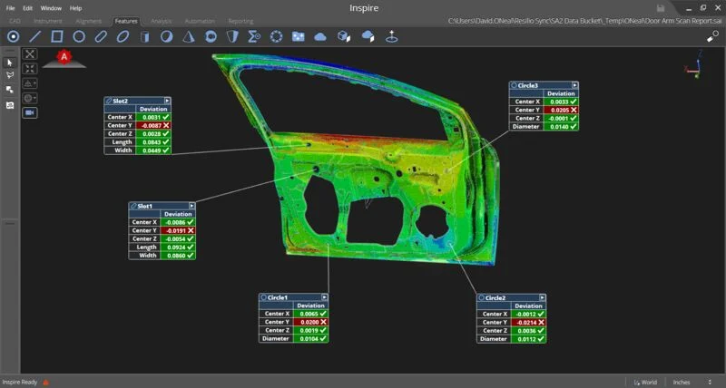 Hexagon Inspire Probing and Scanning Analysis Hexagon Inspire showing a vehicle door panel colour map with deviation results for measured slots and circular features.