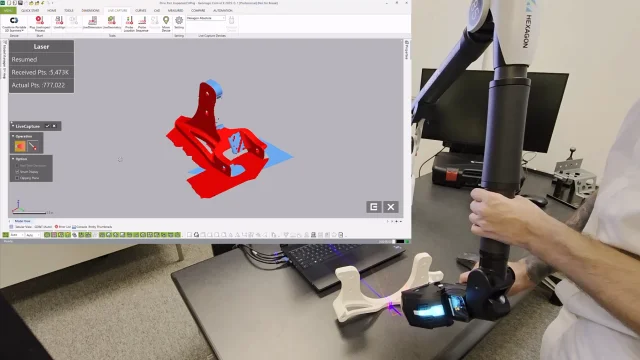 Geomagic Control X 3D Scanner and Portable CMM Integration Operator scanning a component with a Hexagon portable measuring arm while captured 3D data appears in Geomagic Control X.