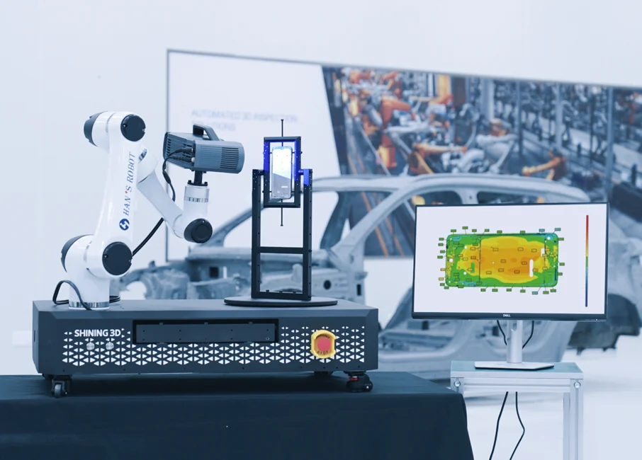 SHINING3D Inspect Automated Inspection System SHINING 3D automated inspection system with robotic arm and monitor showing 3D color-map results