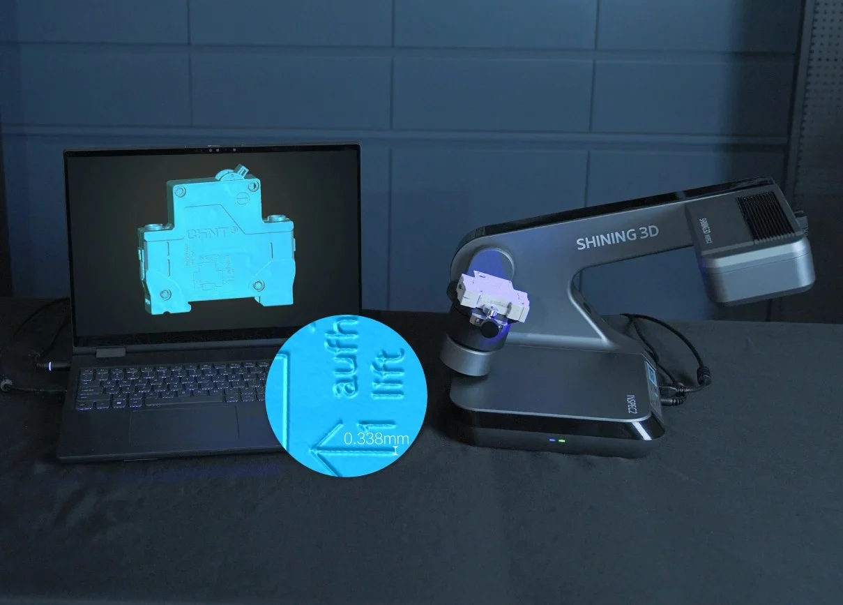 AutoScan Inspec2 High-Resolution 3D Scanning with Dual 5MP Cameras AutoScan Inspec2 scanning a small electrical component, with a detailed 3D model displayed on a laptop and a magnified view of fine surface features.