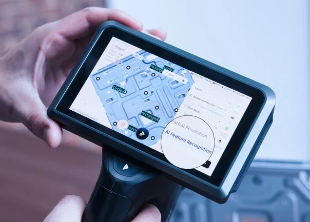 FreeScan Omni Series AI Feature Recognition for Dimensional Inspection FreeScan Omni touchscreen displaying AI feature recognition and measurement of holes and geometric features on a scanned industrial component