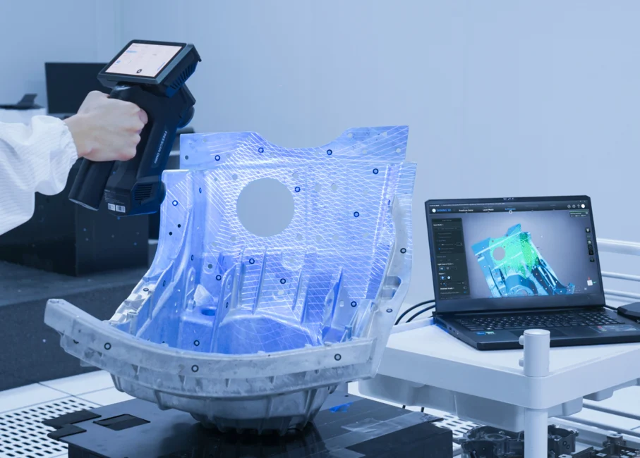 FreeScan Omni Series Industrial 3D Scanning for On-Site Quality Control FreeScan Omni Series scanning a large industrial metal component with 3D measurement data displayed on a nearby laptop