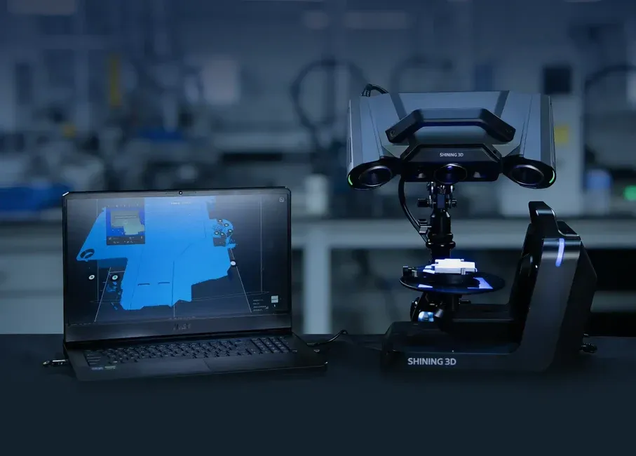 OptimScan Q12/Q9 HD | Automated Dual-Axis 3D Scanning SHINING 3D OptimScan Q12/Q9 HD optical 3D scanner with an automatic dual-axis turntable and laptop displaying 3D scan data.